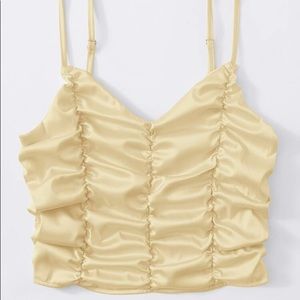 gold puffy top with adjustable straps